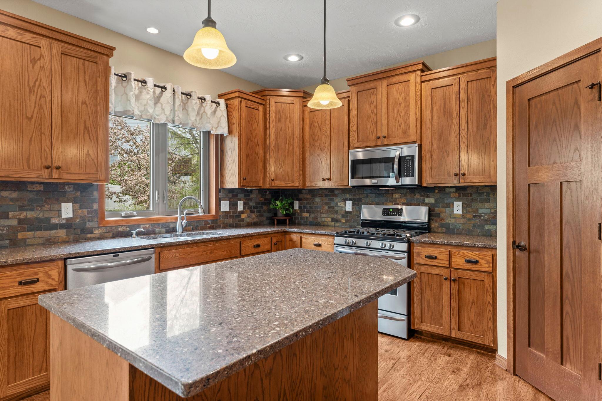 Extra seating and prep space at the center island and plenty of storage in the walk-in pantry