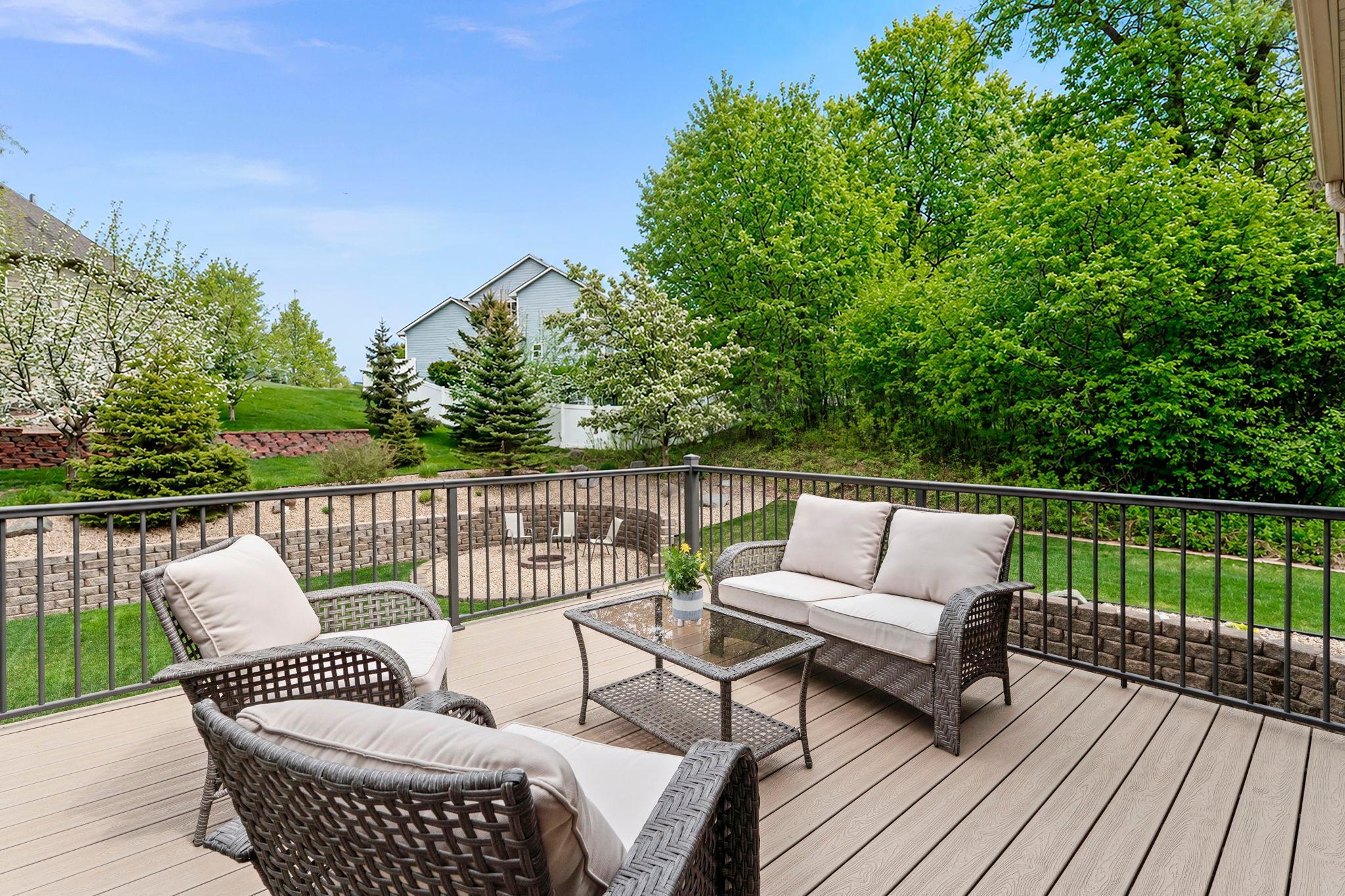 Enjoy the beautifully landscaped yard, surrounded by mature trees and flowers—perfect for soaking in the peaceful, nature-filled setting