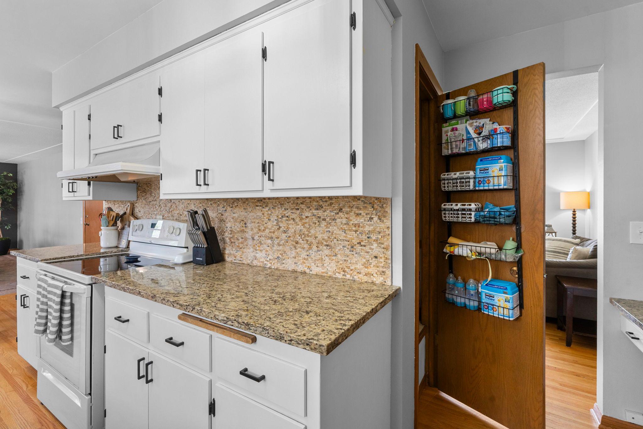 Kitchen also features a lovely pantry to store all your goodies without taking up cabinet space!