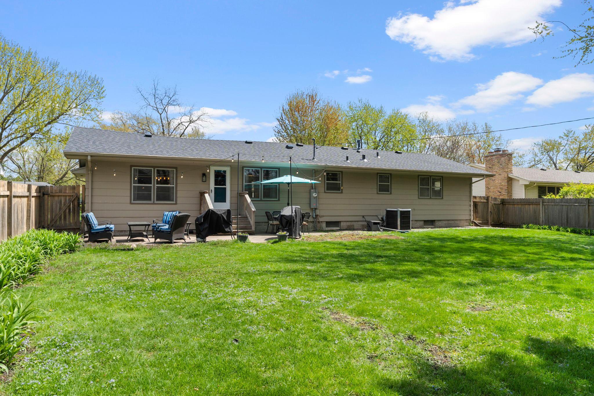 Backyard is fully fenced in with a lovely wood privacy fence.