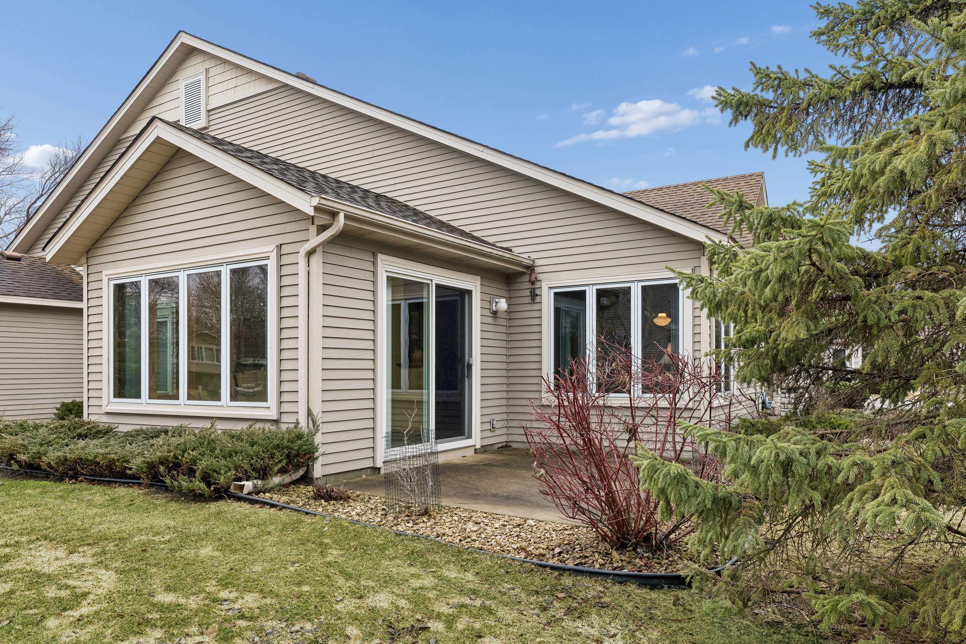 Nice patio with privacy of shrubs and tree