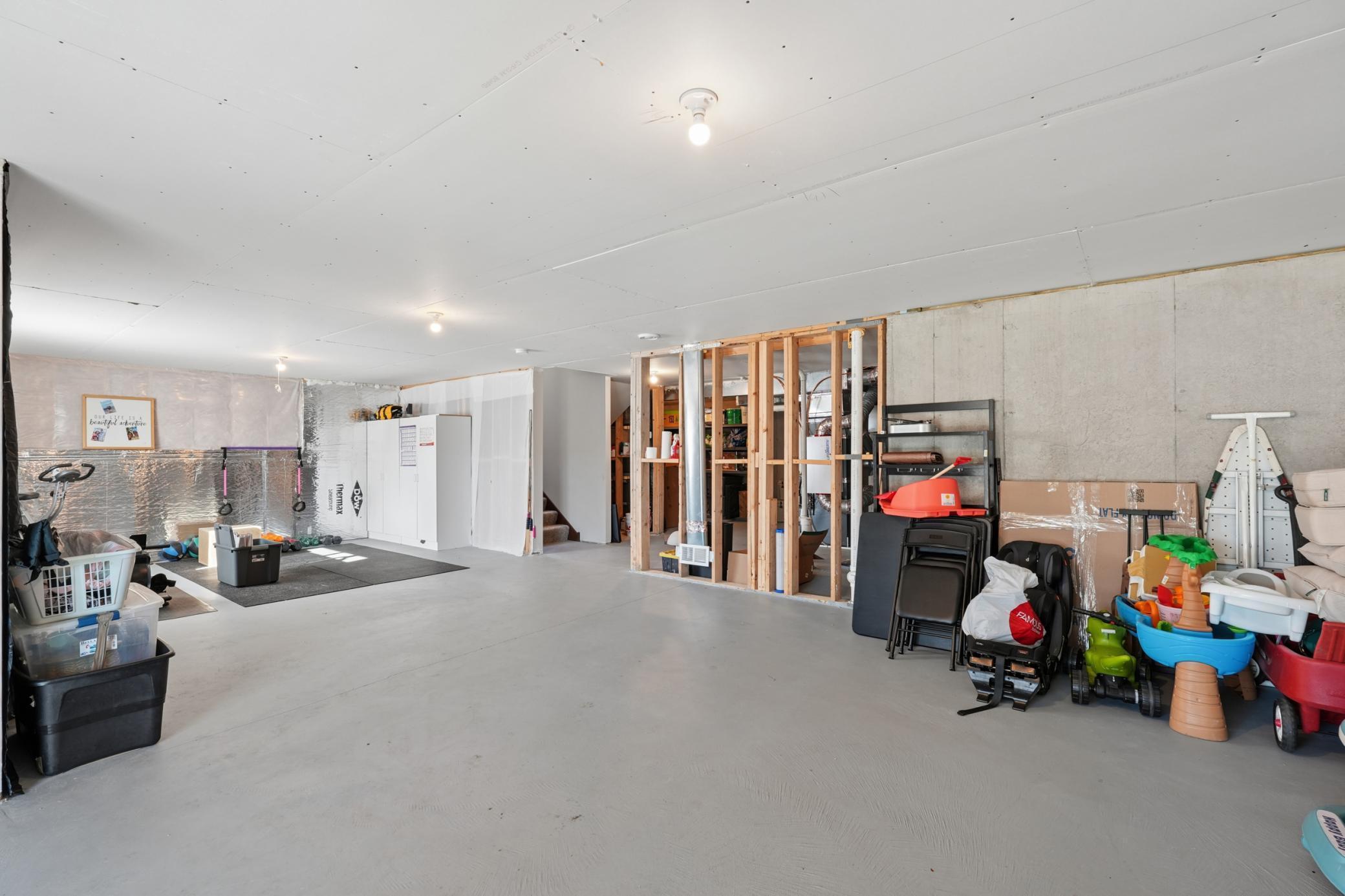 Imagine a future family room, home gym, or theater in this unfinished space