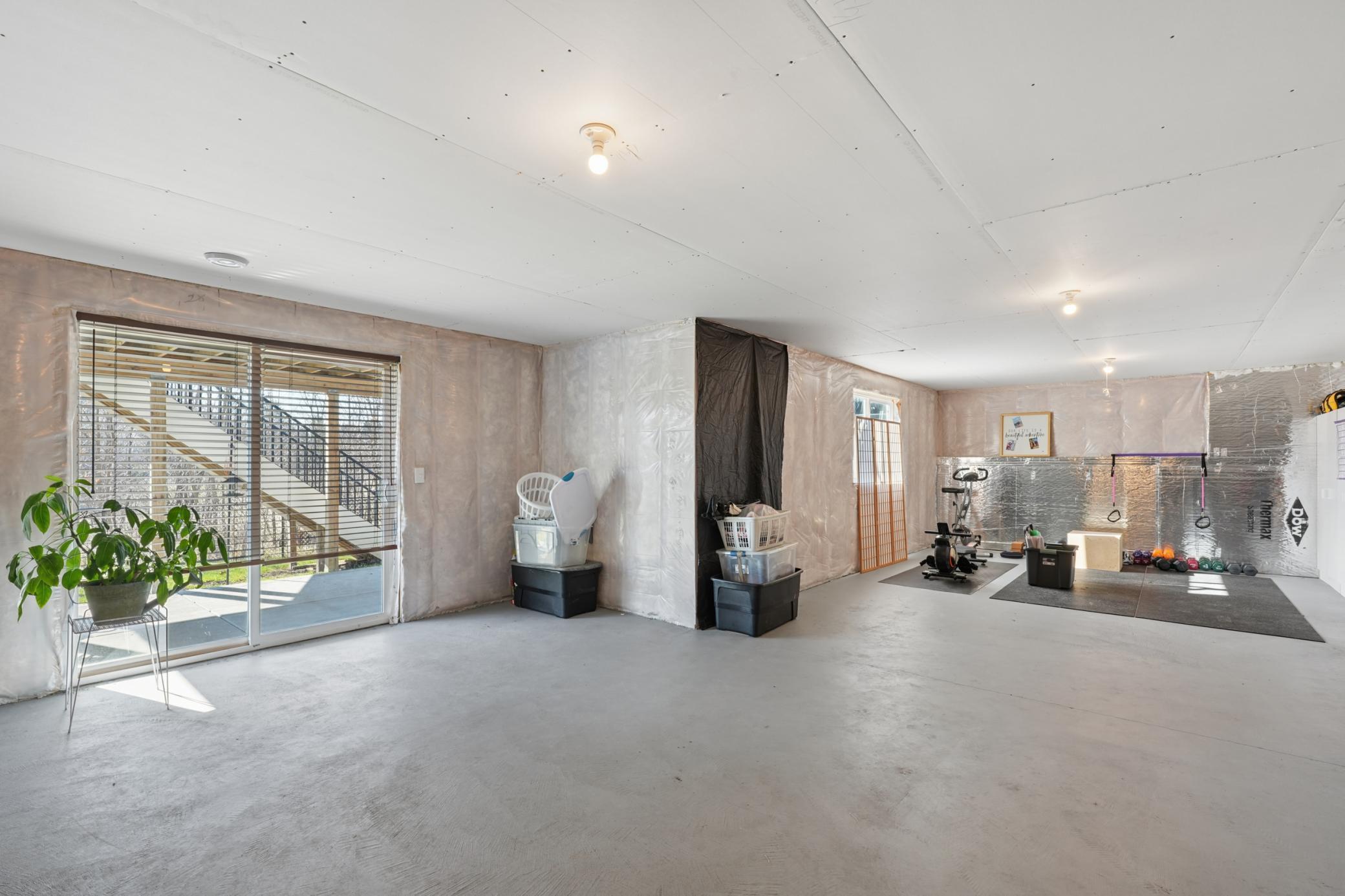 The walkout basement leads directly to the covered lower patio and open yard . Full of potential to create your dream outdoor entertainment space or finishing project