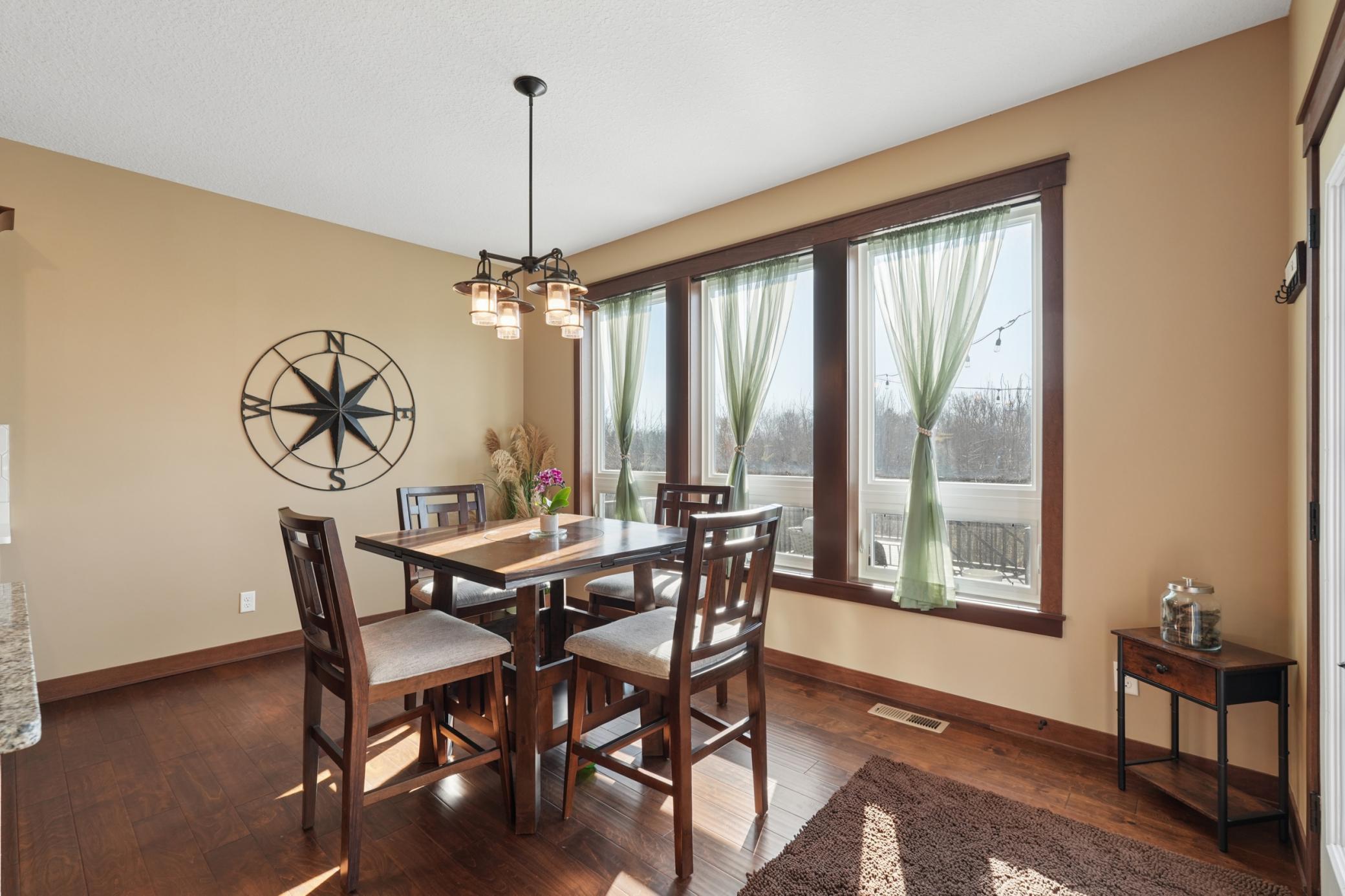 The dining room flows seamlessly from the kitchen , perfect for everyday meals and casual entertaining with easy access to the deck