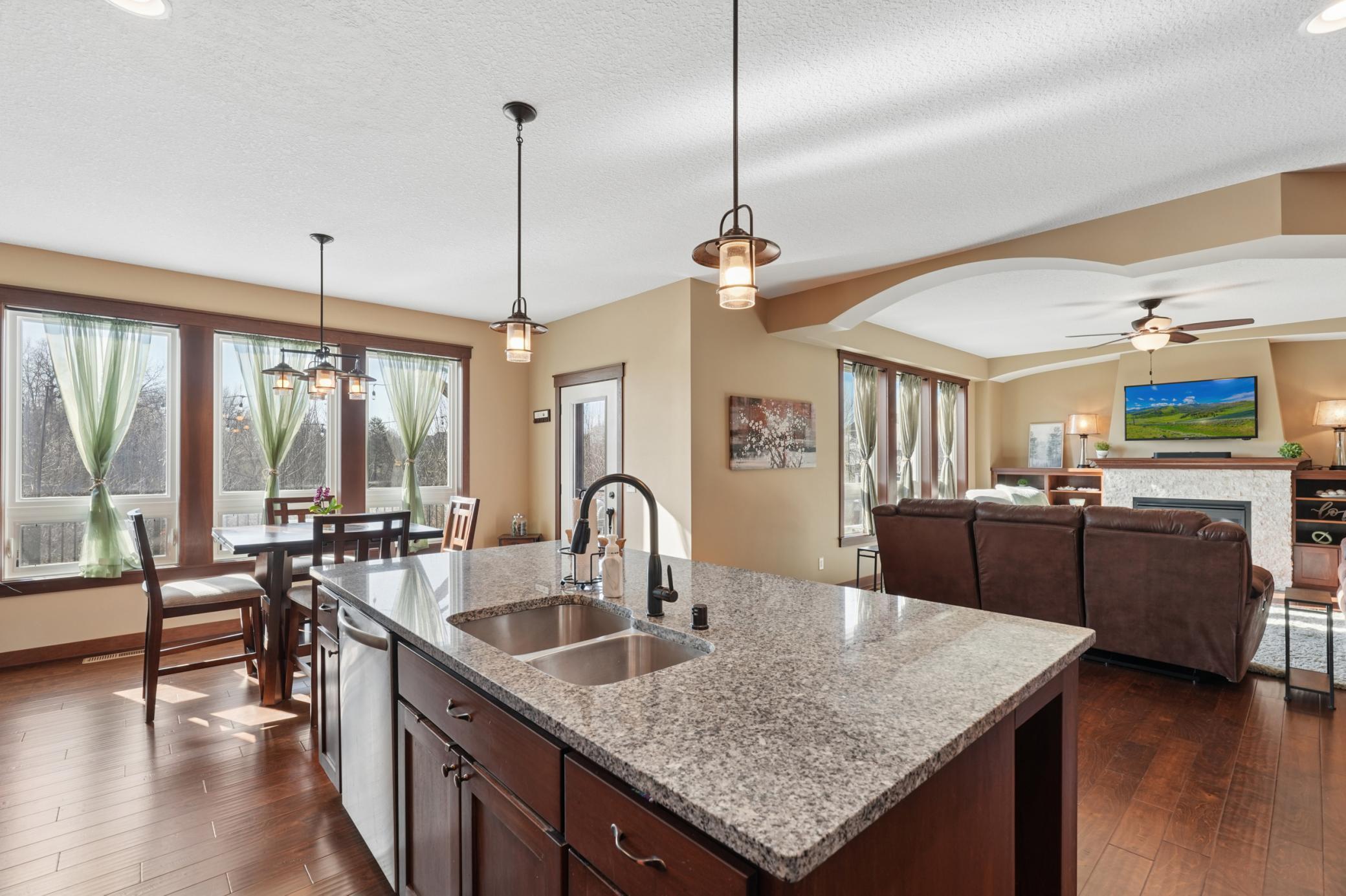 From casual breakfasts to dinner parties, the kitchen delivers with its large island that opens to the dining and living areas.