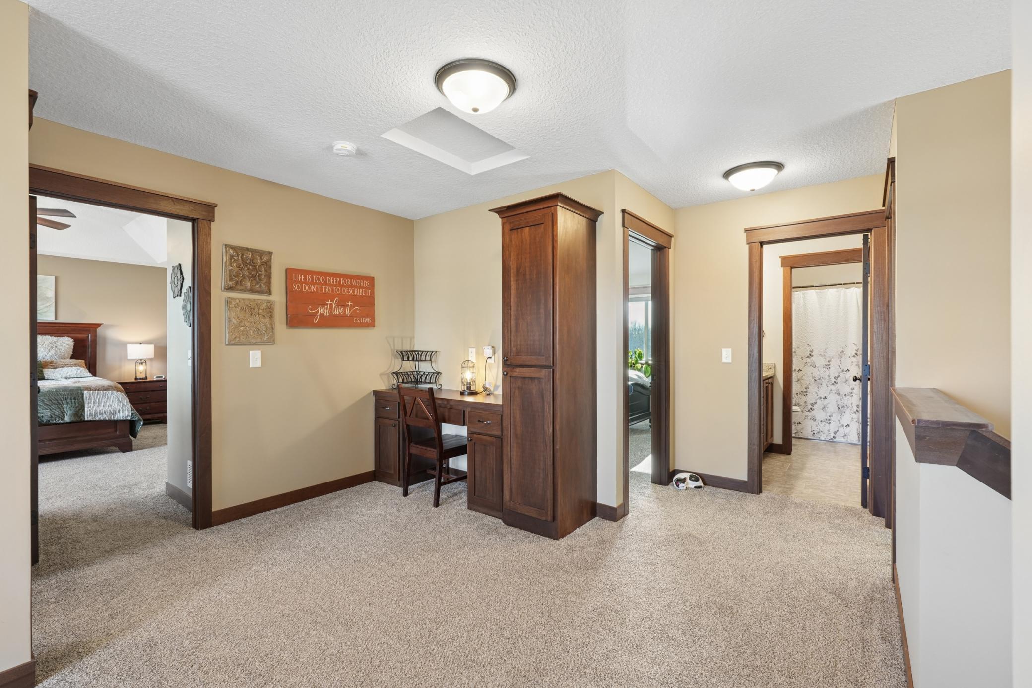 The open upper-level hallway and loft add versatility to this home . An airy landing that keeps all four bedrooms connected while offering its own functional living zone