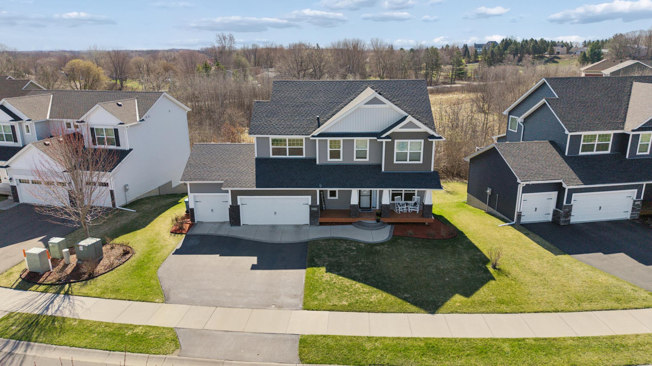 : Striking Two Story curb appeal with a classic covered front porch