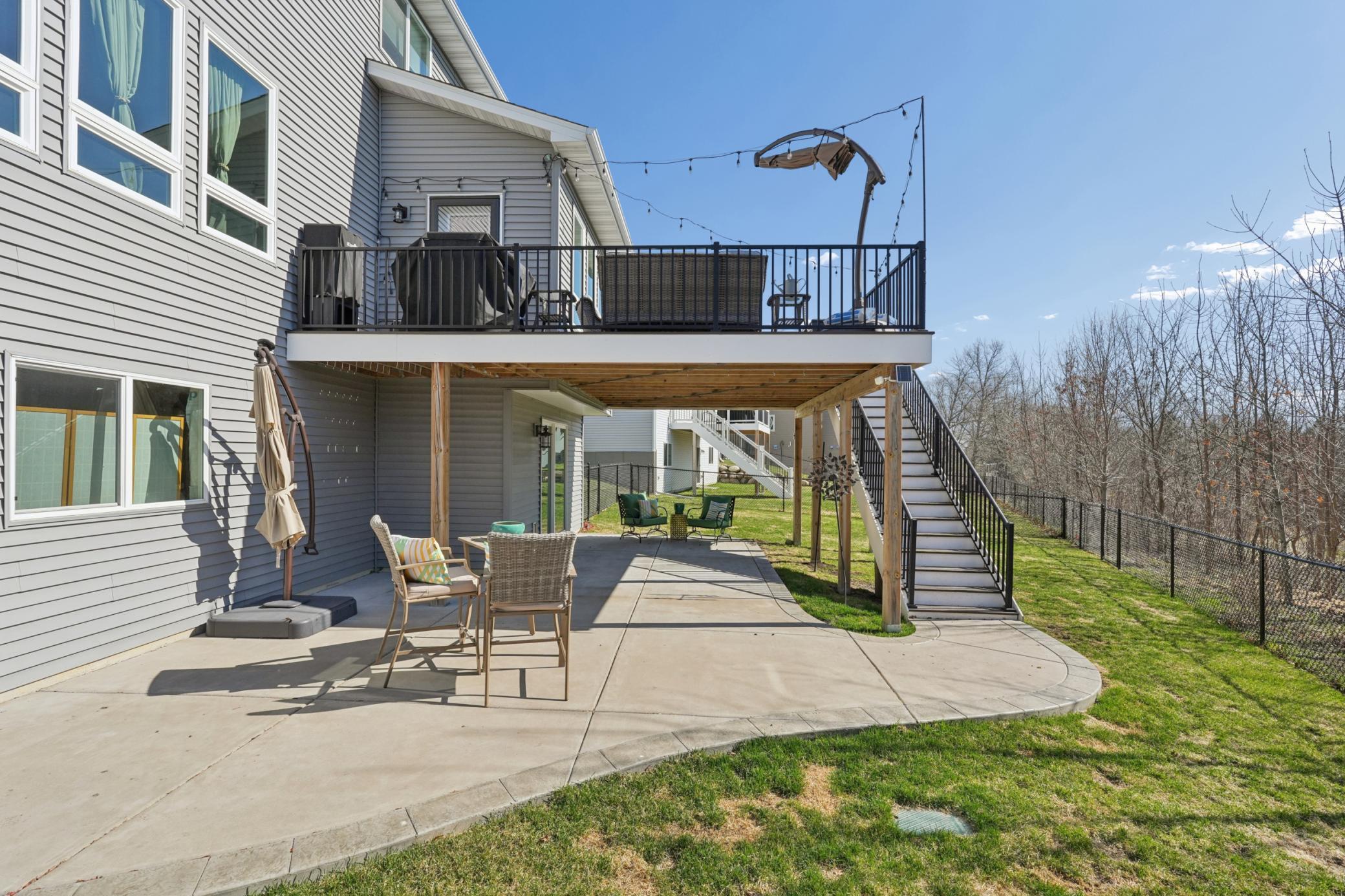 Outdoor living shines here! The large upper deck is perfect for grilling and al fresco dining, while the lower walkout patio creates a covered retreat in the shade below. Two distinct outdoor living zones for every mood and season.