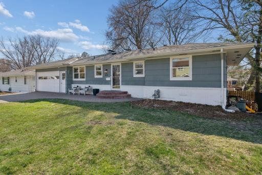 This walkout rambler is situated on the spacious lot so well!