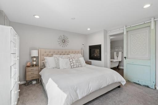 The 2 sided fireplace adds amazing ambience to this bedroom.