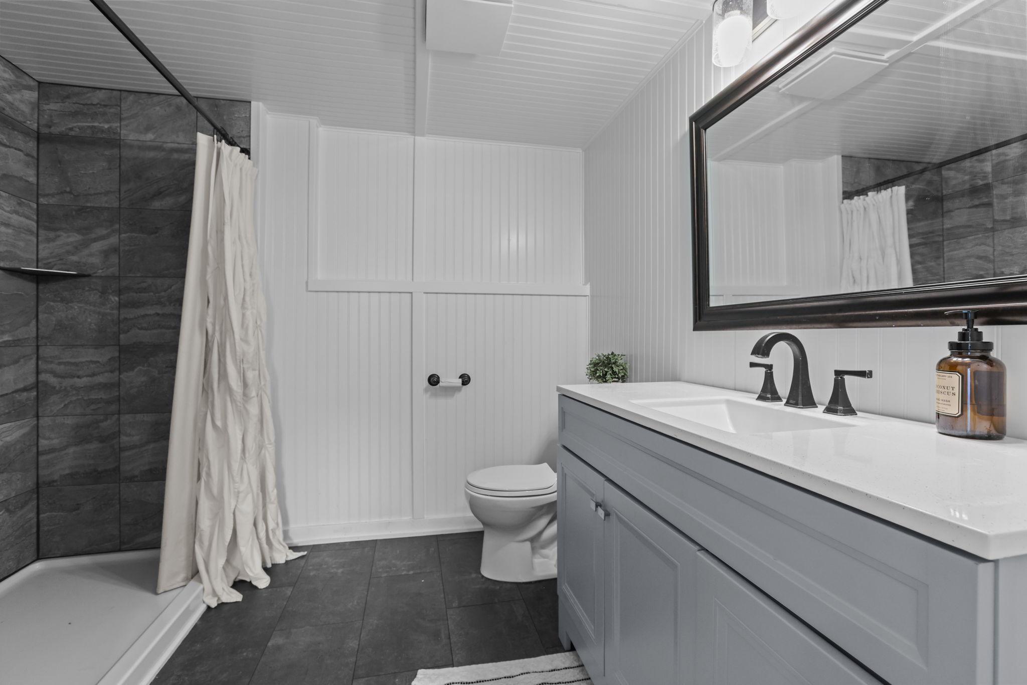 NEW 3/4 Bathroom with Custom Tile in Lower Level