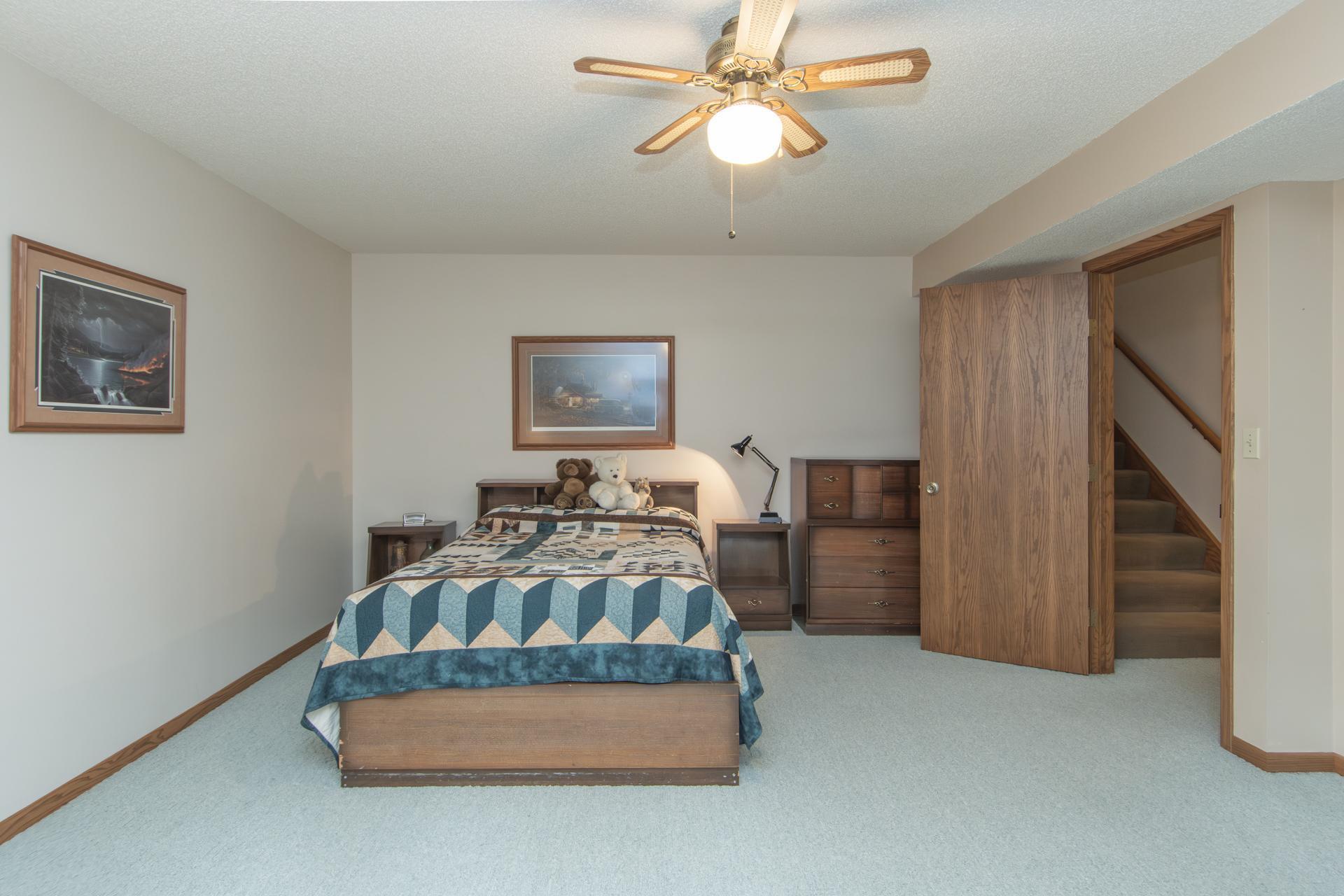 Comfortable lower-level bedroom offering privacy and flexibility.