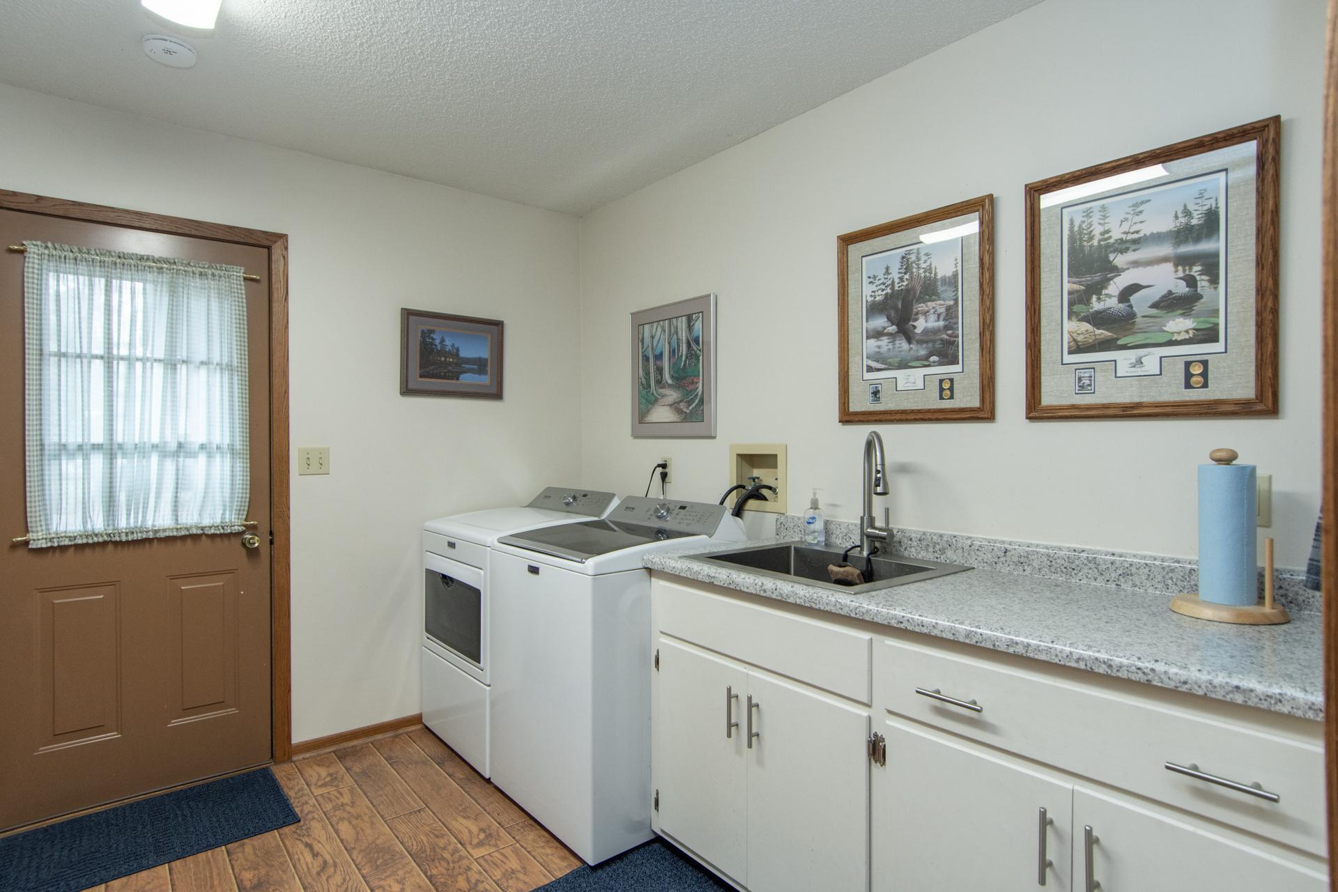 Convenient laundry area with space for storage and everyday functionality.