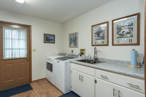 Convenient laundry area with space for storage and everyday functionality.