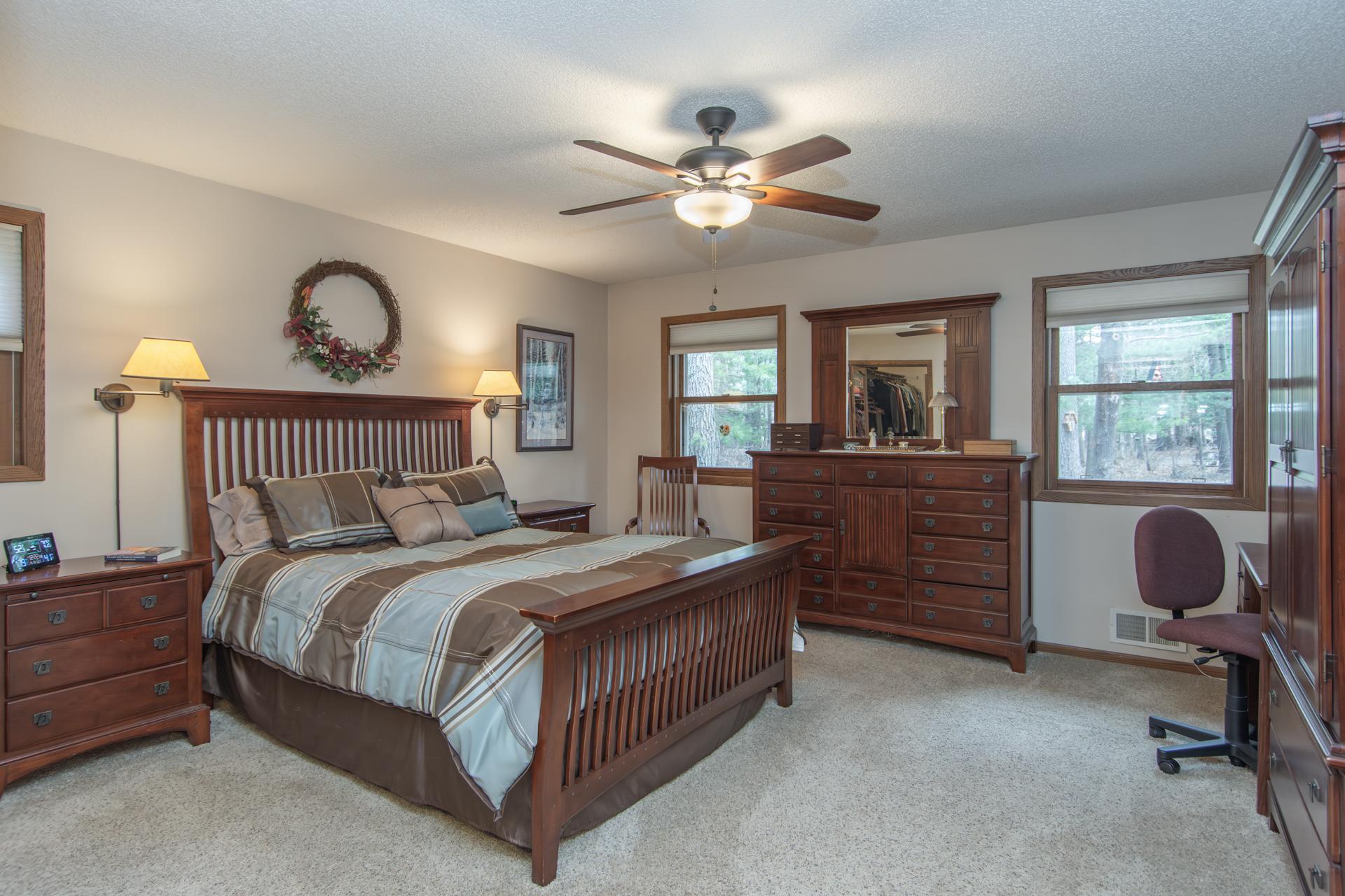 Spacious primary suite with room for a full bedroom set and additional seating.