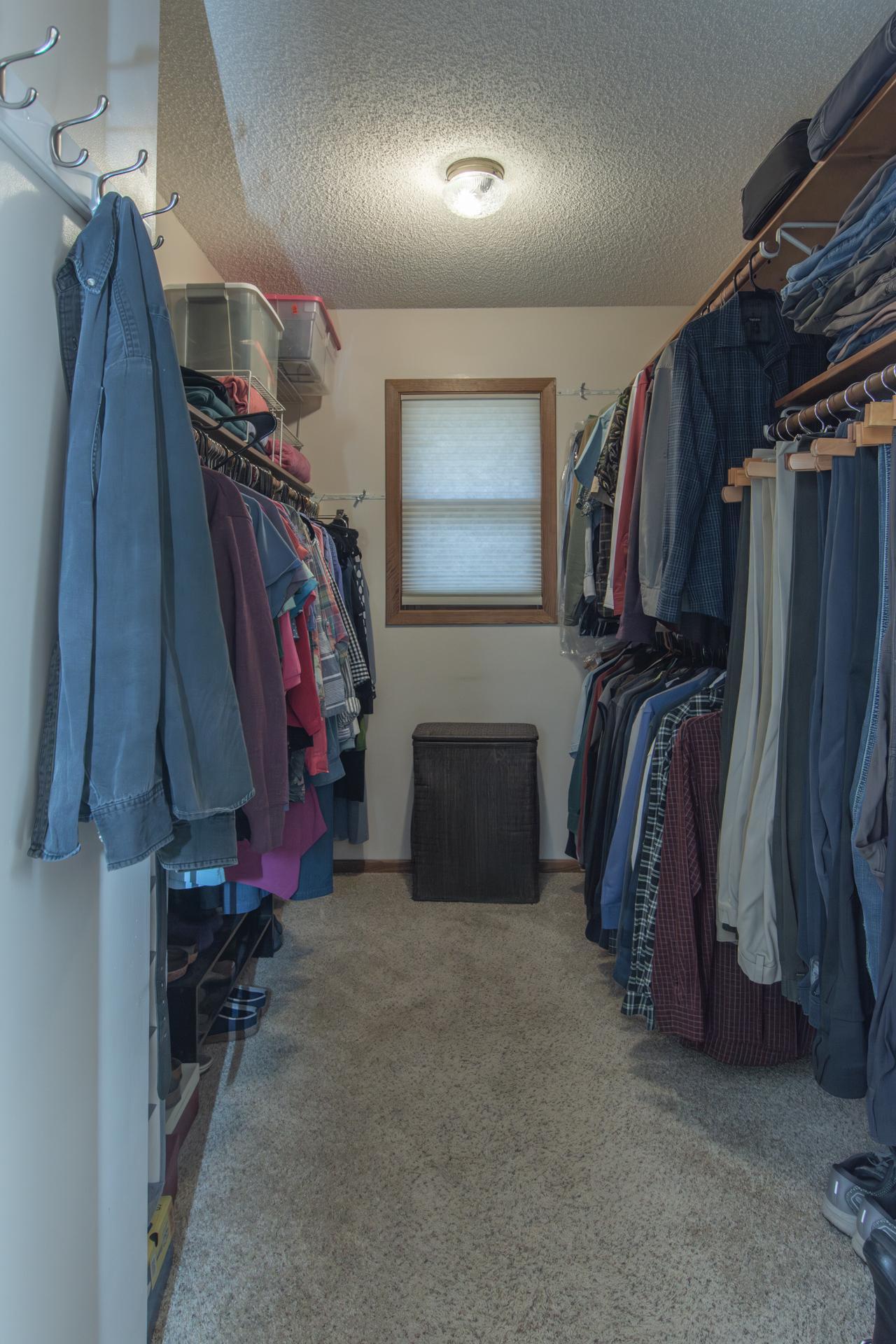 Generous primary bedroom with ample closet space.