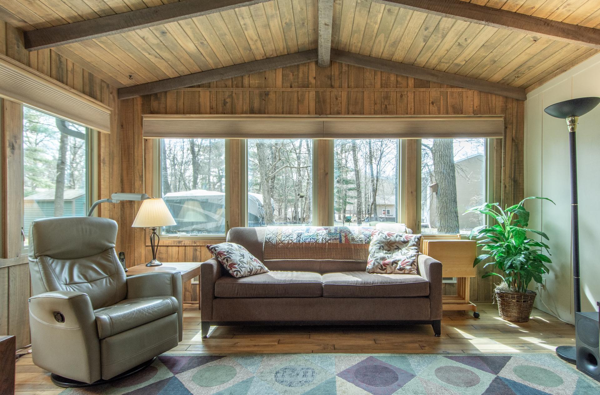 Bright room with large windows showcasing beautiful views.