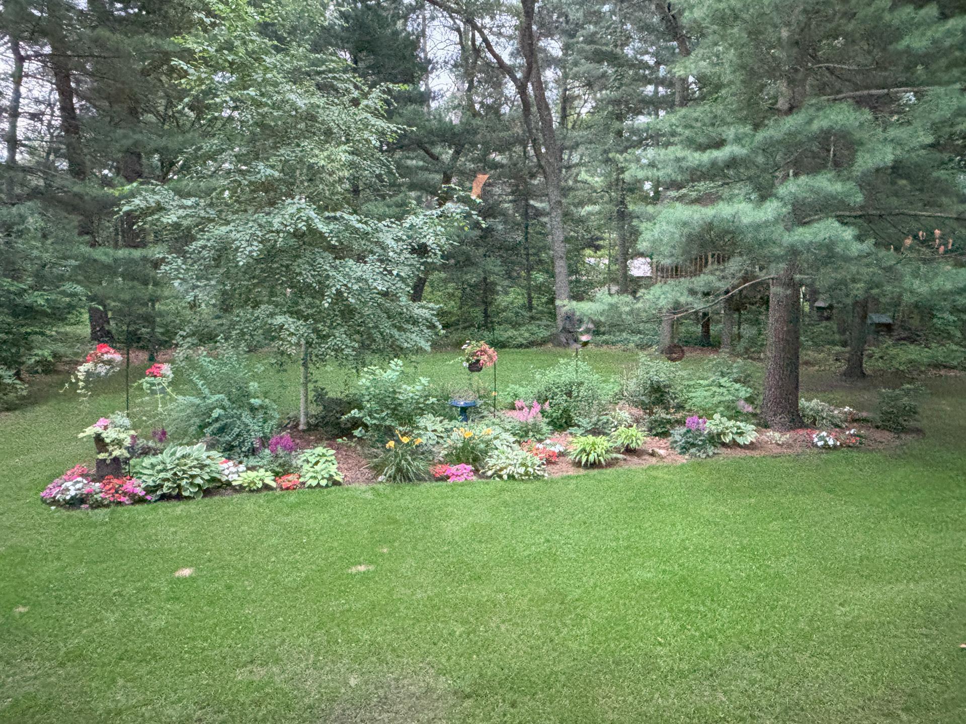 Enjoy bursts of color and texture with blooming flowers surrounding the home.