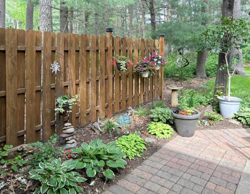 A lovely mix of flowers and greenery creates a serene outdoor retreat.