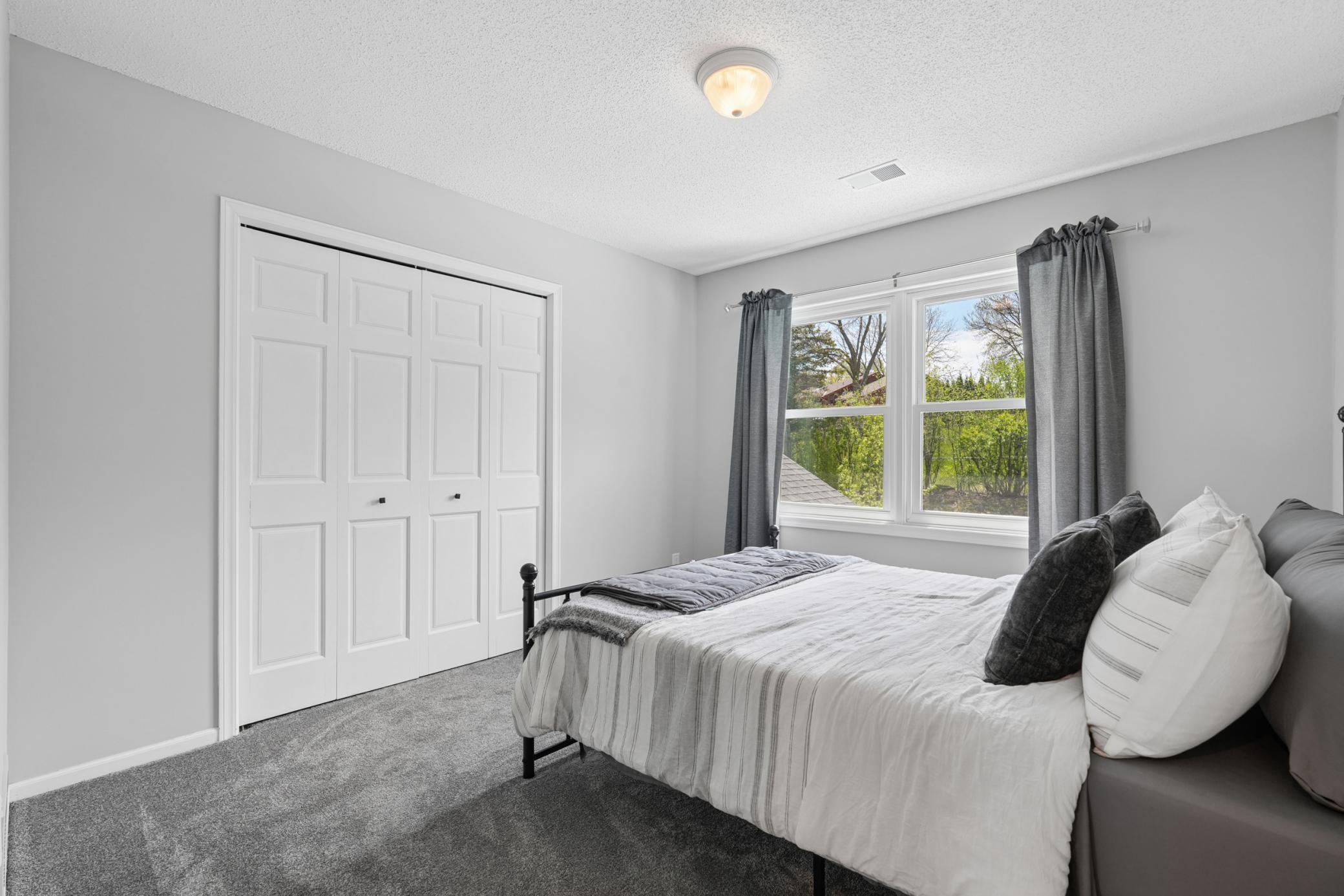 One of four upper level bedrooms.