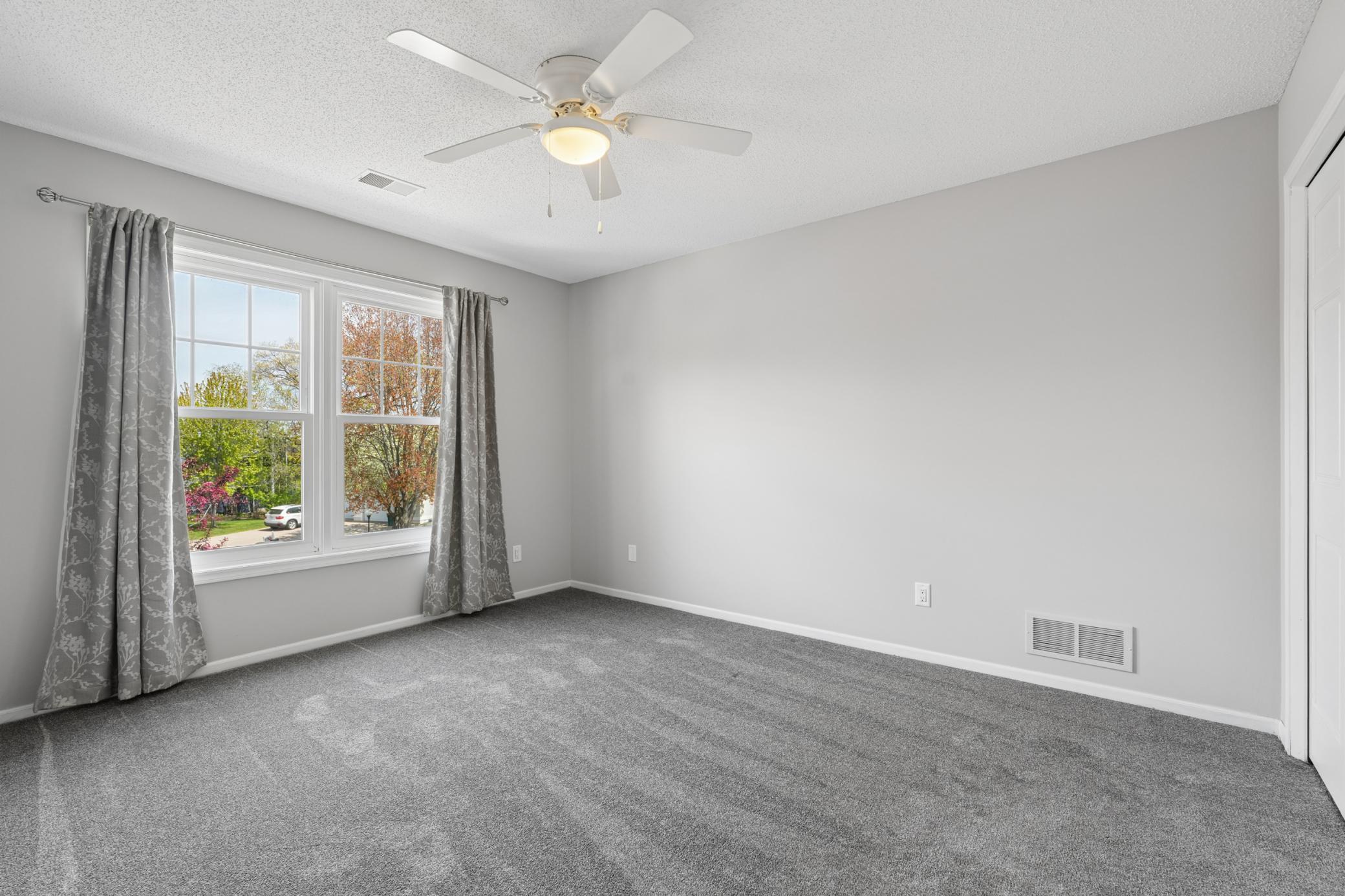 One of four upper level bedrooms.
