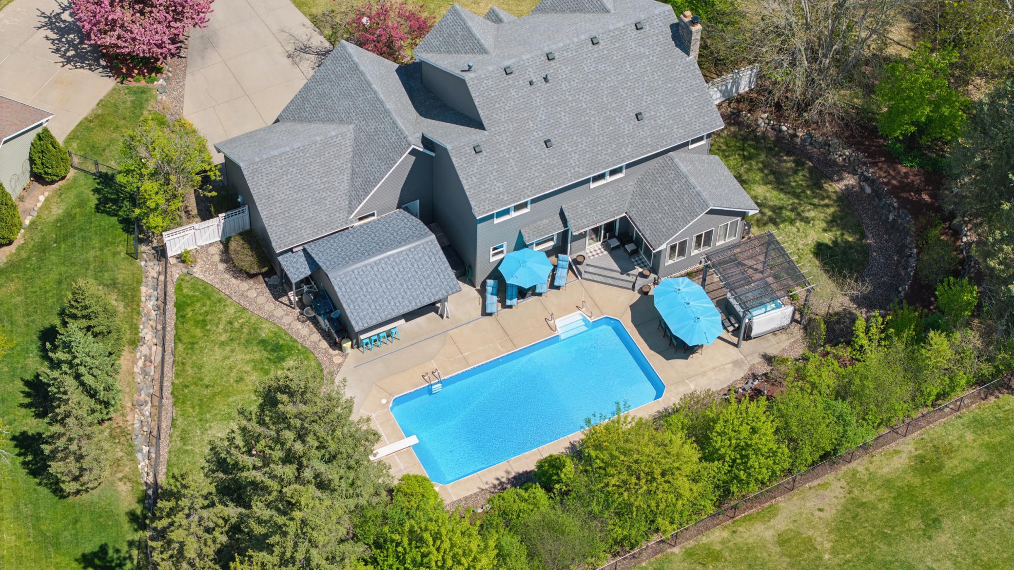 Fantastic heated, underground pool with covered bar area, hot tub & beautiful gardens!