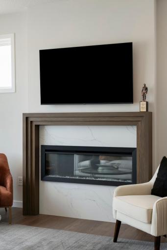 Beautiful fireplace with warm-toned wood making this space feel like a home.
