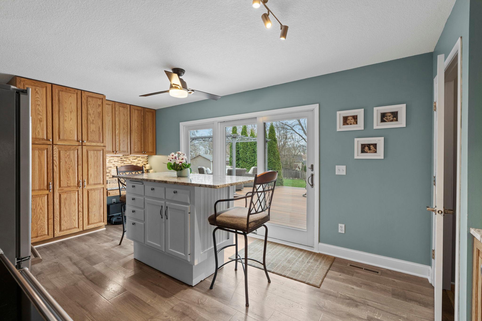Oversized patio door walks out from kitchen to private, backyard deck! A ton of cabinetry offers room for all the extras.