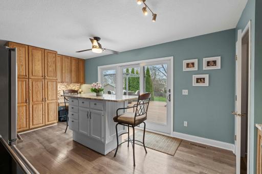 Oversized patio door walks out from kitchen to private, backyard deck! A ton of cabinetry offers room for all the extras.