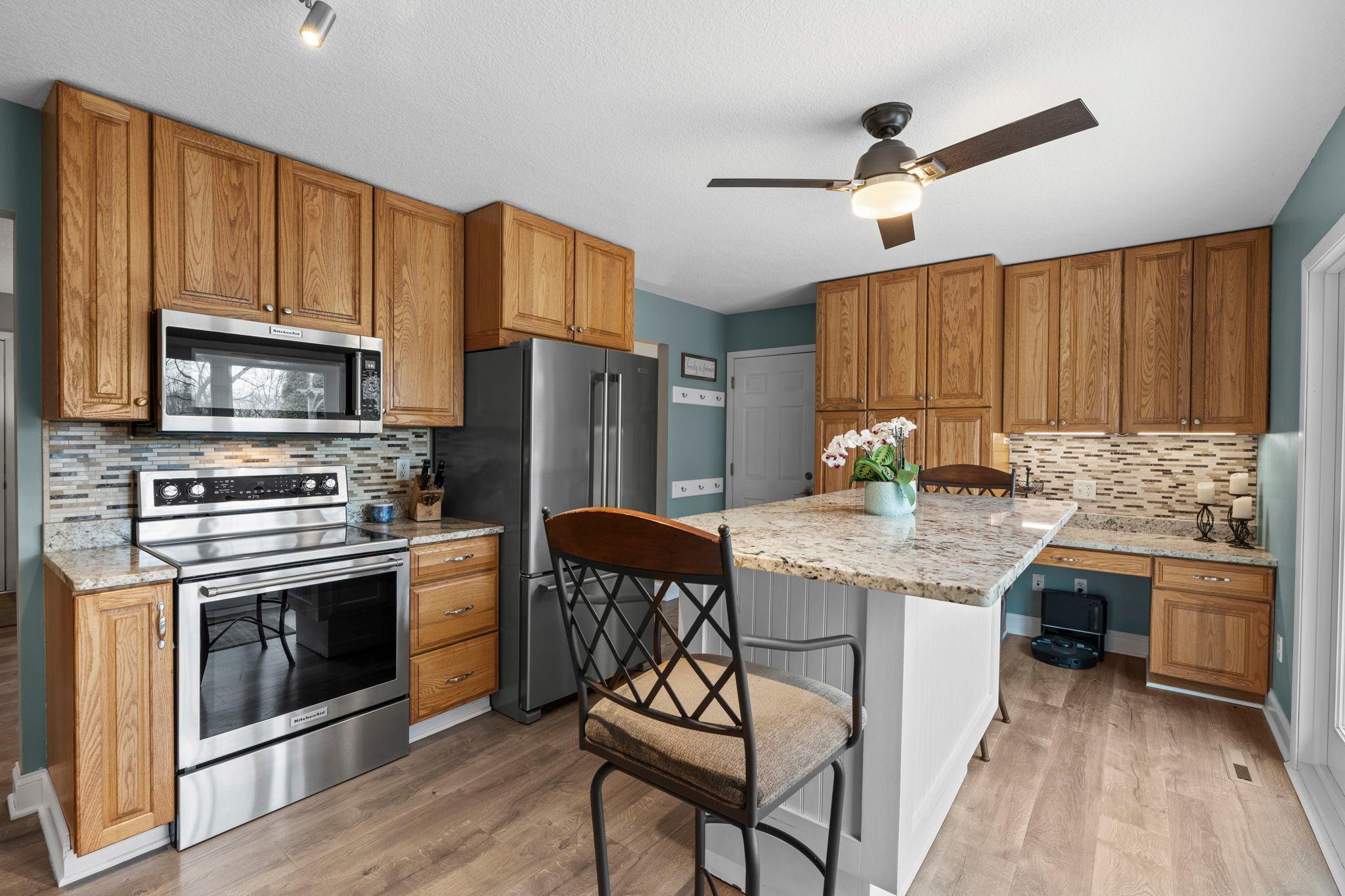 Newer Stainless Steel appliances and Granite countertops are the highlight of this space.