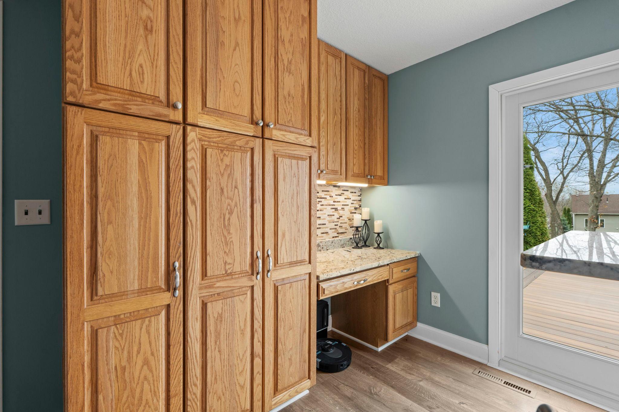 Abundance of cabinetry for all the extras. Desk area is a perfect command center for a busy homelife.