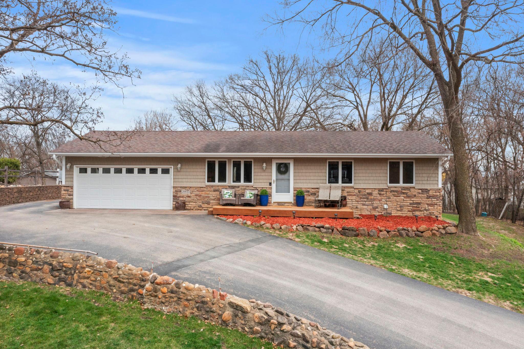 Standout curb appeal. Sit back, relax and soak up the sunsets from your front patio.