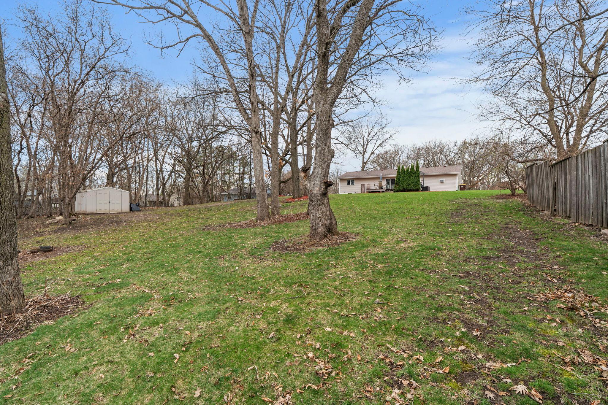 Backyard storage shed adds space for all the extras. Check out this amazing lot!
