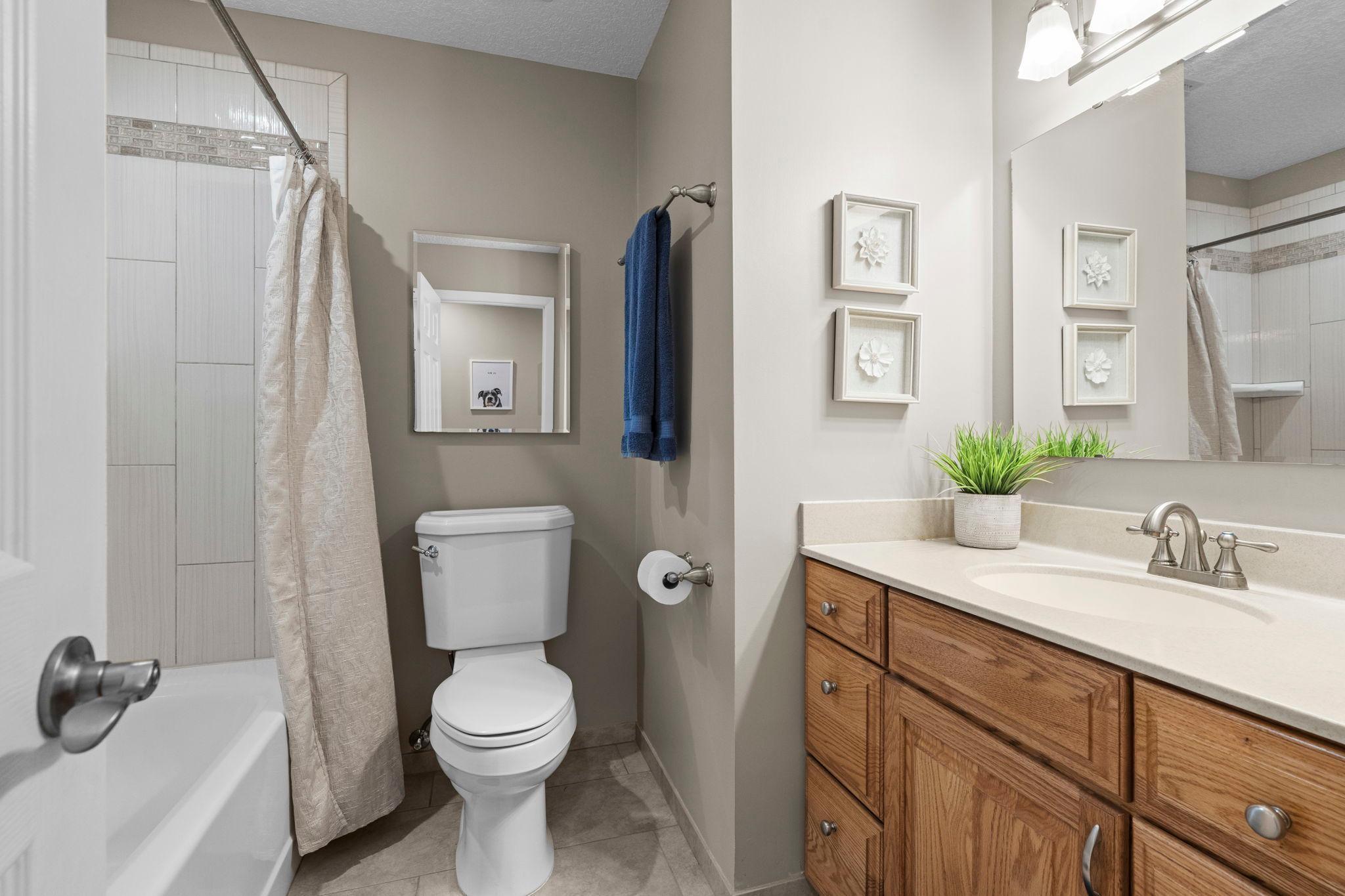 Two beautiful bathrooms! One on each level, full bathroom on the main! Check out the gorgeous tiled shower!