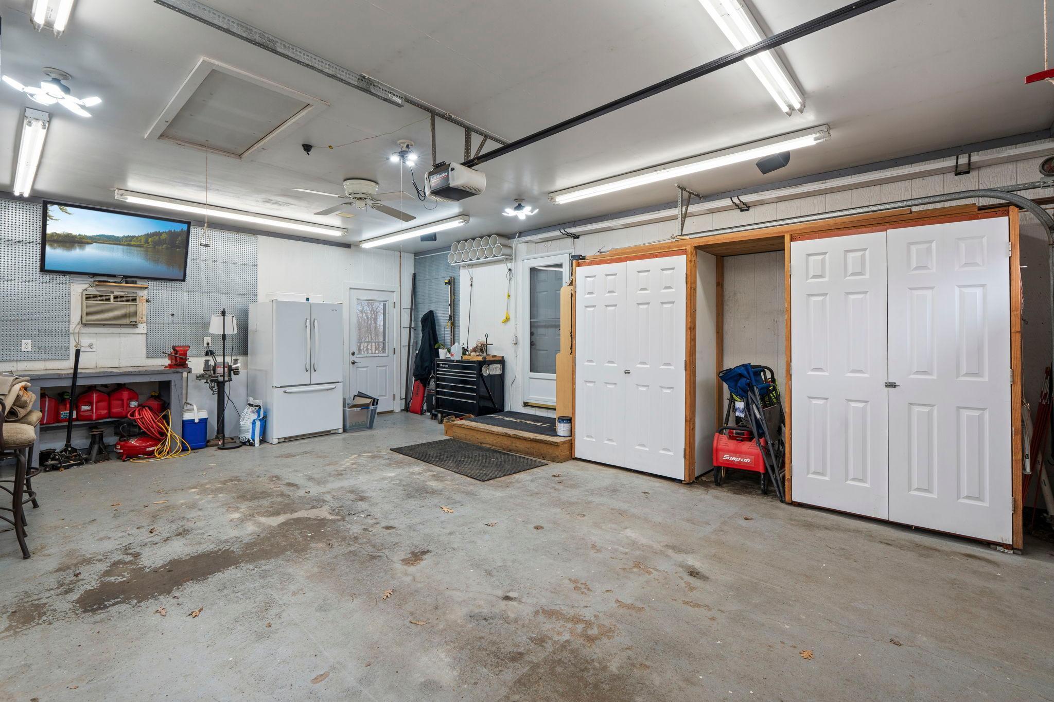 Fantastic finished garage with storage closets and workbench!
