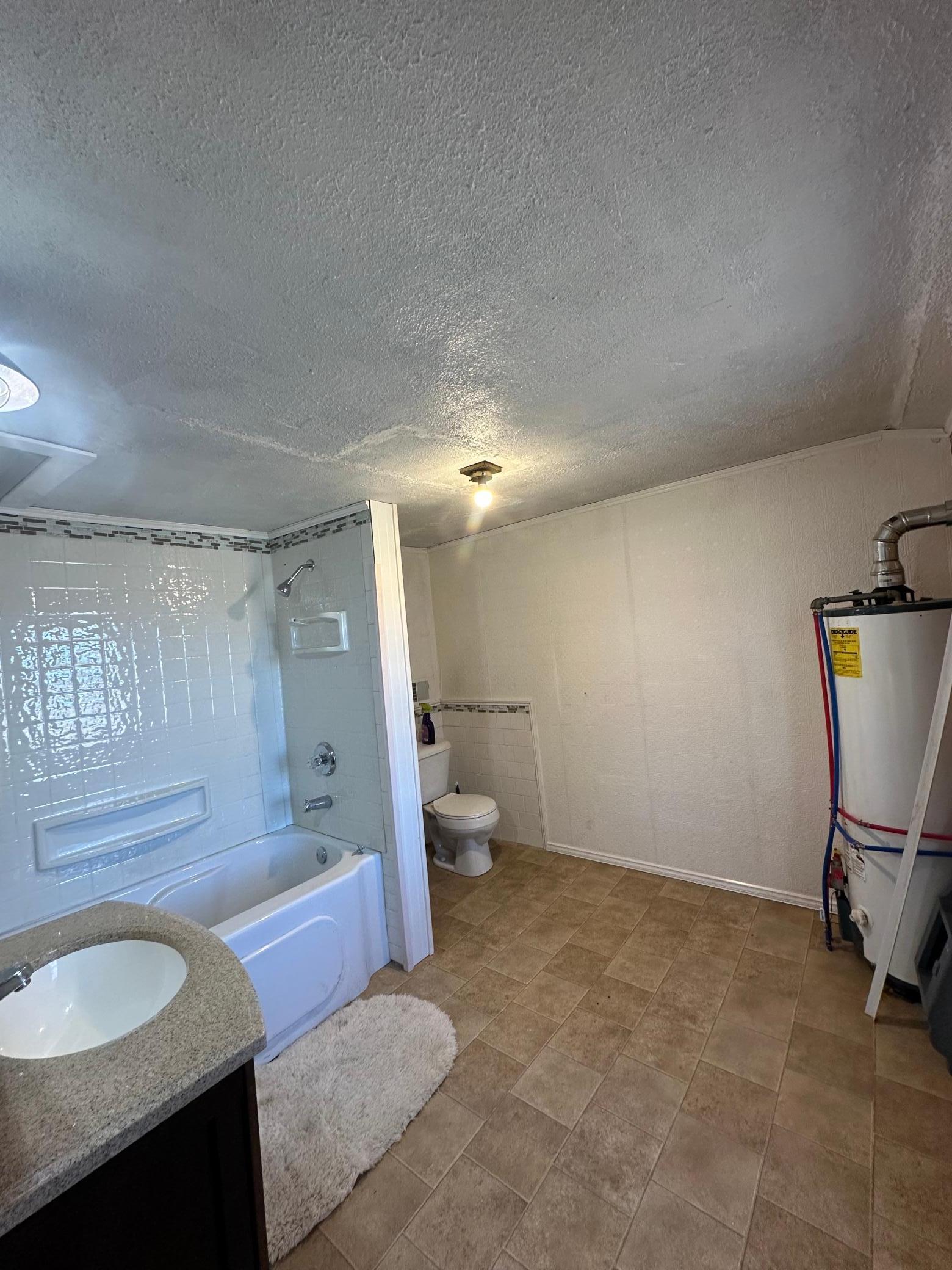 Full Bathroom with Tile Flooring