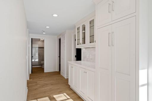 Main floor pantry with two adjacent bedrooms