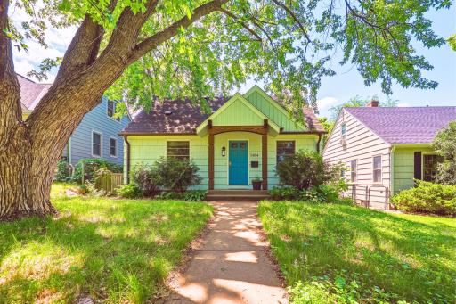 A lush, tree-shaded front yard and classic walkway welcome you home to this beloved Armatage gem.