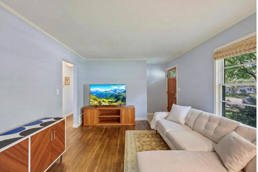 A bright, easy-living space with hardwood floors, crown molding, and a layout that flows effortlessly through the main level.