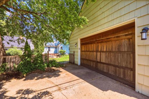 The detached, oversized, heated one-car garage features a bar rough-in and a classic wood door â with extra room for a workbench, bikes, lawn equipment, and more.