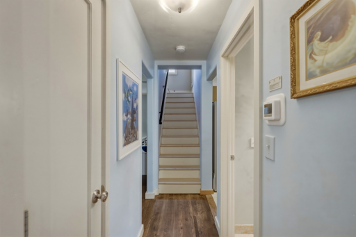 New maple hardwood staircase leading you up to your private primary suite â a retreat all its own.