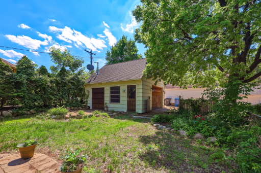 Surrounded by established garden beds, a detached one-car oversized, heated garage is tucked at the back of the lot. The side garage door provides easy access to the second paver patio.