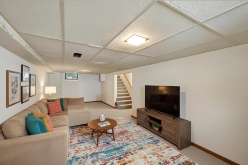 Spacious basement Family Room - AI staged to show the possibilities!