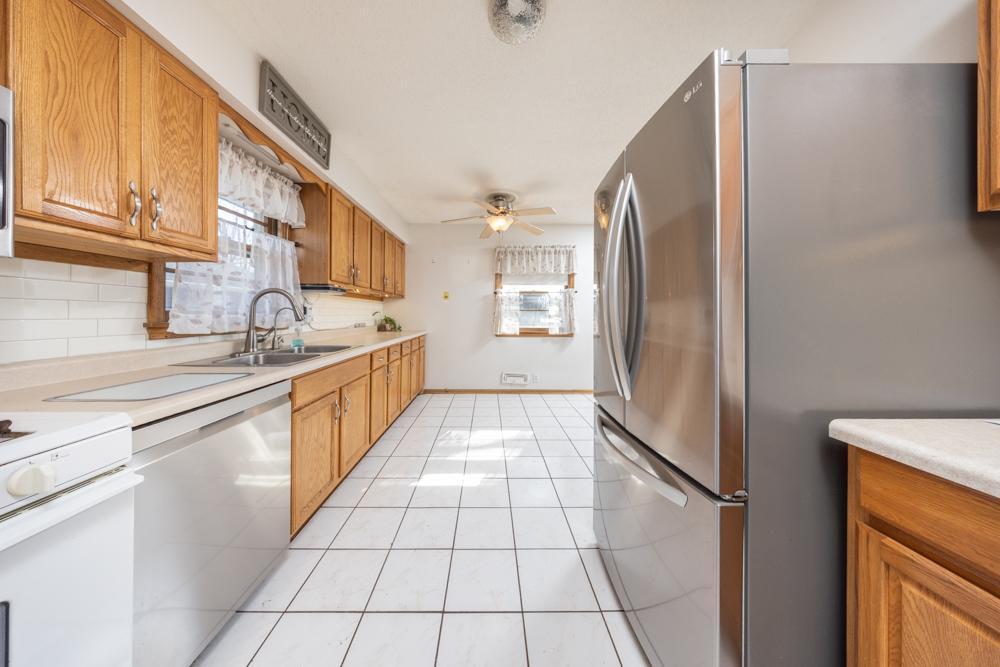 The kitchen is finished off with details like the tile backsplash and tile flooring