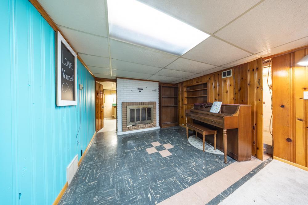 This space is anchored by a stunning brick fireplace