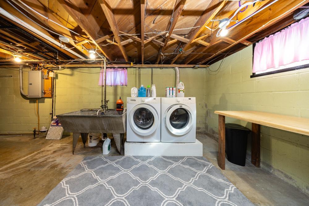 Laundry room with elevated washer and dryer