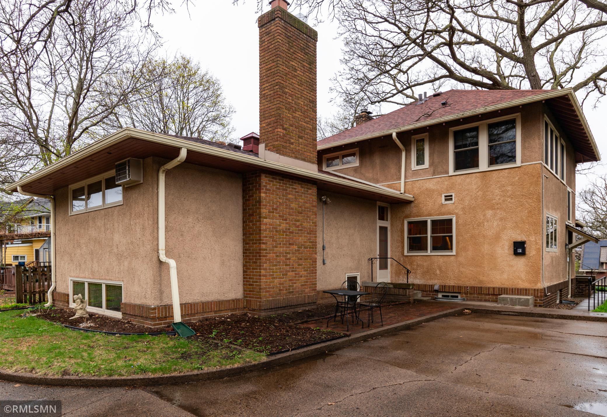 Backyard smaller of two patios and parking pad