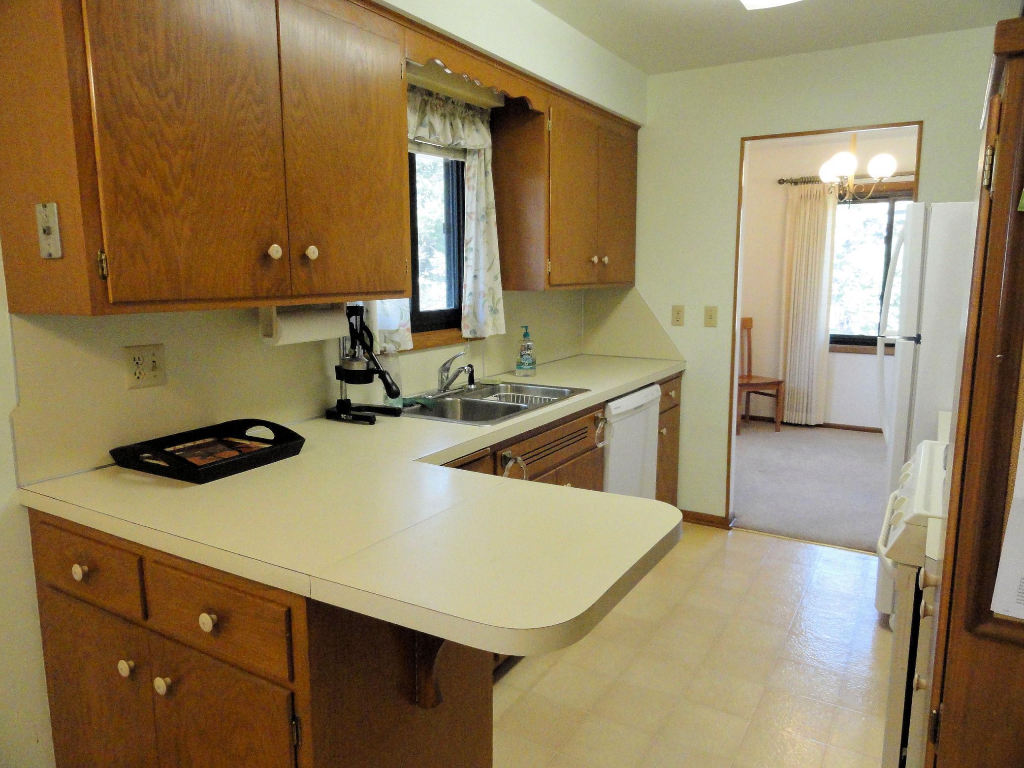 Expandable prep space is at home in this kitchen. Simply fold the peninsula into position. Great flexibility! Plus, quick food service to both dining spaces.