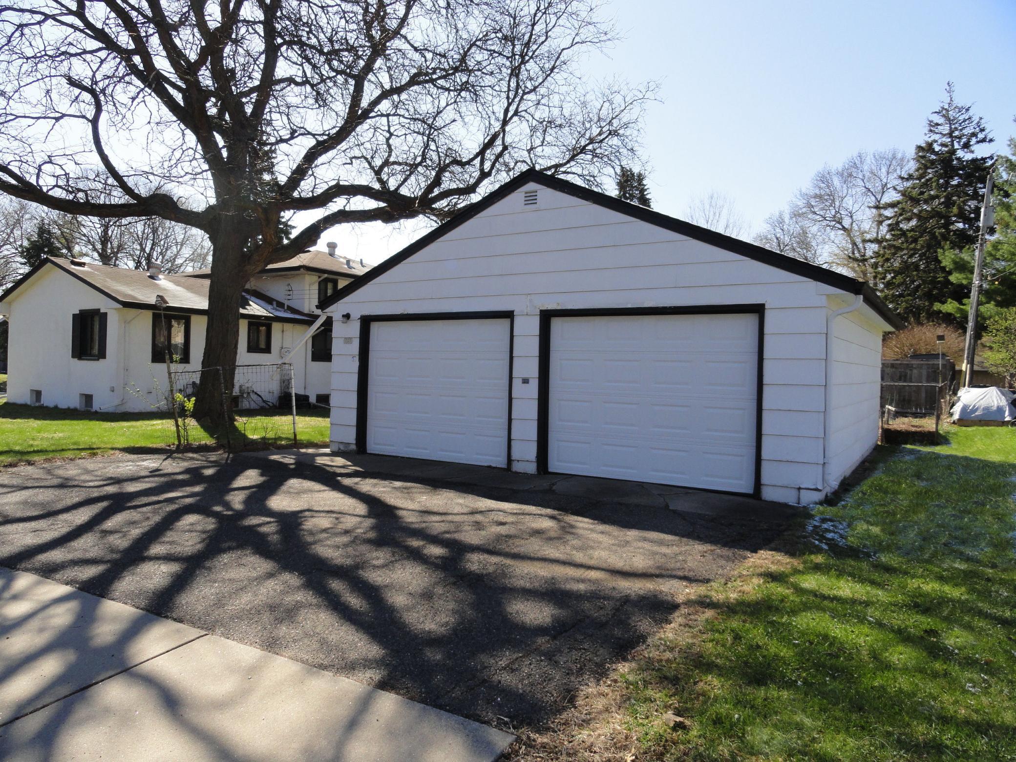 Better than other 2 car garages! The twin overhead doors provide more space between your vehicles! Easier coming & going, nice!