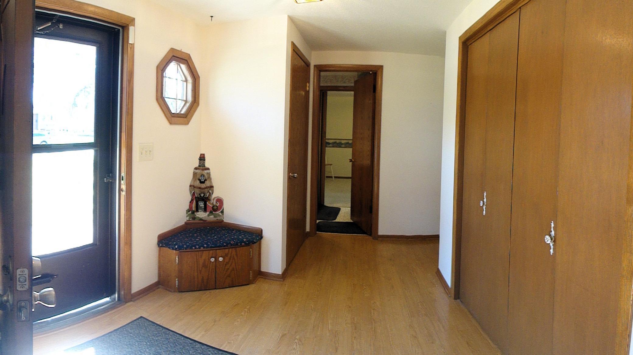 Better than most, this foyer provides a built-in seat to remove shoes, plus extra storage. Plus, two closets are here! Nice!
